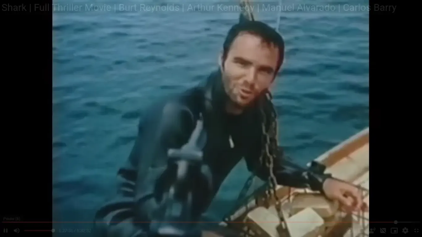 Shark (1969) - Burt arises from the water